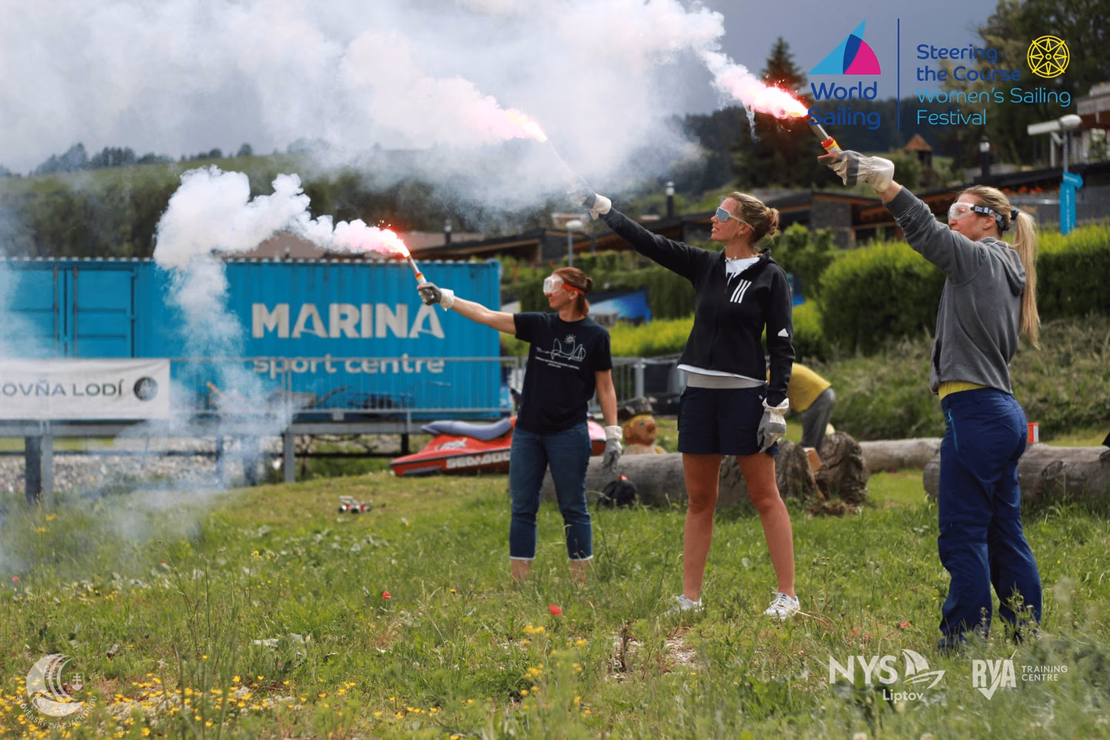 Sea survival course participants practising with handheld flares at Marina Liptov