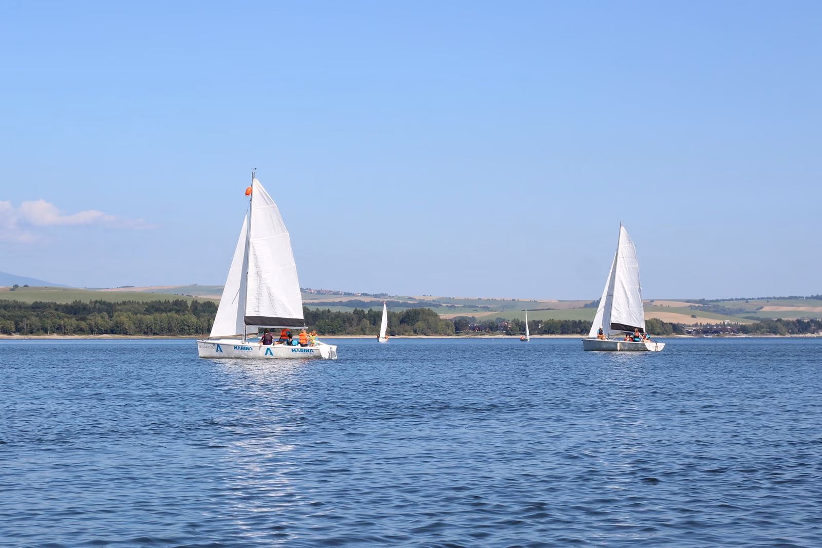 Sailing boats with crews on Liptovská Mara lake